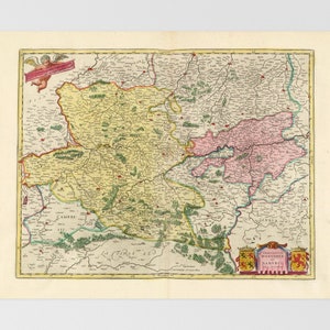 May include: A vintage map of a region, featuring detailed cartography with various colors. The map has a yellow and pink color scheme, with green and brown accents. A small cherub with a banner is in the upper left corner.