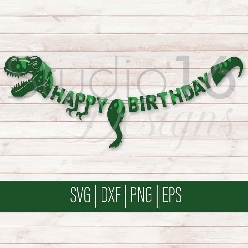 May include: Green dinosaur birthday banner with the words "Happy Birthday" on it. The banner is made of paper and has a green and white camouflage pattern.