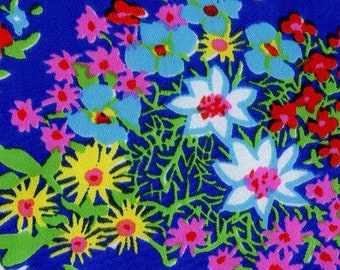 Silky Floral Fabric From Klopman Mills.  Bold, Primary Colors on a Bright Blue Background.  Perfect for Scarf, Blouse, or Dress.  Easy Care.