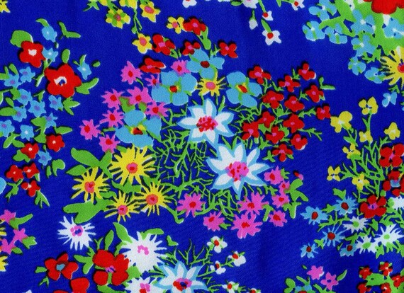 Silky Floral Fabric From Klopman Mills.  Bold, Primary Colors on a Bright Blue Background.  Perfect for Scarf, Blouse, or Dress.  Easy Care.