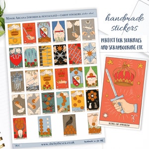 May include: A sheet of handmade tarot stickers featuring the Minor Arcana suits of Swords and Pentacles. The stickers have colorful illustrations of tarot cards, including the King of Swords. The text "handmade stickers" is also visible.