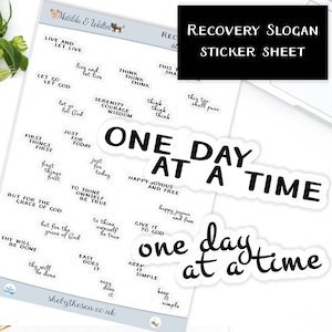 May include: A sticker sheet with various recovery slogans in black text on white stickers. Phrases include "One Day at a Time," "Live and Let Live," and "Just for Today." The sheet also features the text "Recovery Slogan Sticker Sheet."