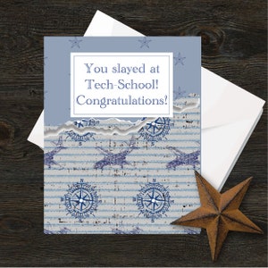 May include: A blue and white graduation card with a nautical theme. The card has a torn edge and features a compass and airplanes. The text on the card reads "You slayed at Tech-School! Congratulations!"