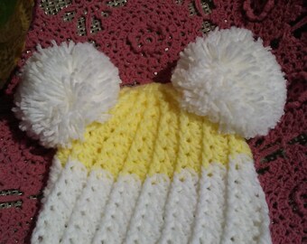 Crochet baby hat with double pom pom