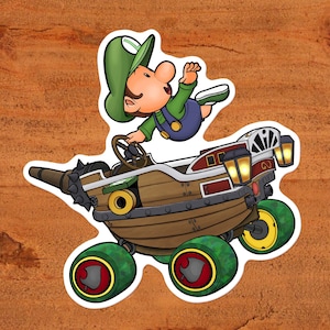 Baby Luigi alla guida del Landship Kart da Mario Kart (con pneumatici a foglia) - Nintendo Glossy Vinyl Sticker Custom Hand-Drewn Art
