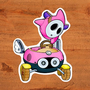 Pinker Shyguy Fahren Pinker Biddybuggy glänzender Vinyl Nintendo Shy Guy Videospiel-Aufkleber, zwei Größen Kundenspezifische handgezeichnete Kunst von Mario Kart