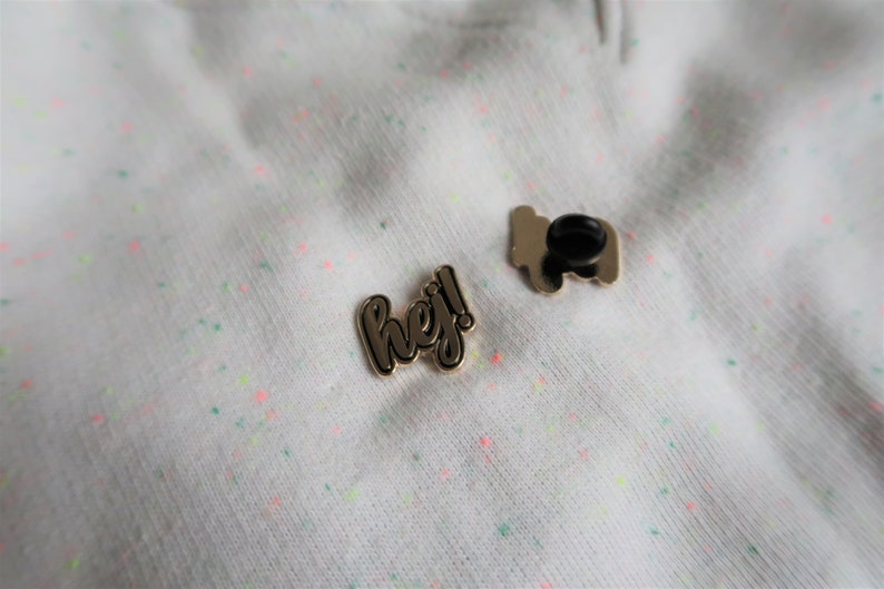 Hej in black Sweden inspired enamel pin