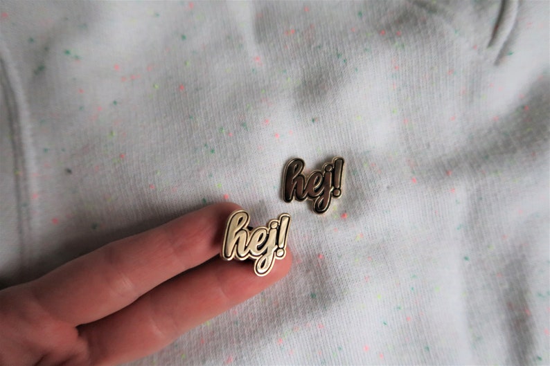 Hej in black Sweden inspired enamel pin