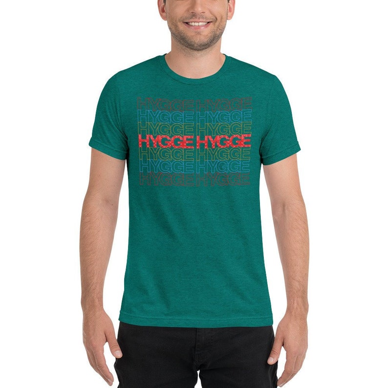 May include: A teal green t-shirt with the word "HYGGE" repeated in a rainbow pattern.
