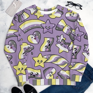 May include: A purple sweatshirt with a pattern of yellow, gray, and white stars, hearts, clouds, and rainbows. The pattern is repeated throughout the sweatshirt. The sweatshirt has long sleeves and a crew neck.