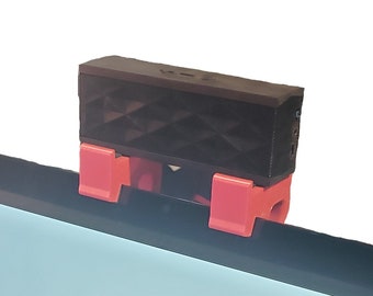 A Peloton compatible speaker shelf hang brackets  (Gen2/3 or Bike+)