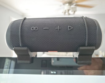 A Peloton compatible speaker shelf for JBL Flip speaker and UE Blast