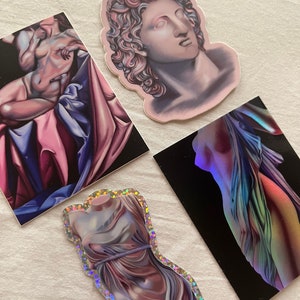 May include: Four different stickers featuring various artistic depictions of classical sculptures. The stickers are printed on white paper with a glossy finish. The sculptures are depicted in a realistic style with a focus on the human form. The stickers are perfect for adding a touch of art and culture to any surface.