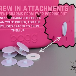 May include: A close-up of a bright pink bag with white screw-in attachments and spacers. Text on the bag reads "SCREW IN ATTACHMENTS" and "PREVENT CHARMS FROM EVER POPPING OUT". The bag has the brand name "bogg".