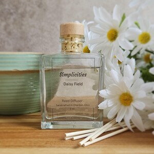 May include: A rustic wooden sign with the text "Welcome to our home" in white lettering. The sign features a distressed finish and a simple, inviting design, perfect for a front porch or entryway.