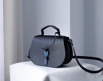 Unique Saddle Bag with Full Flap Design and Leather Key Closure