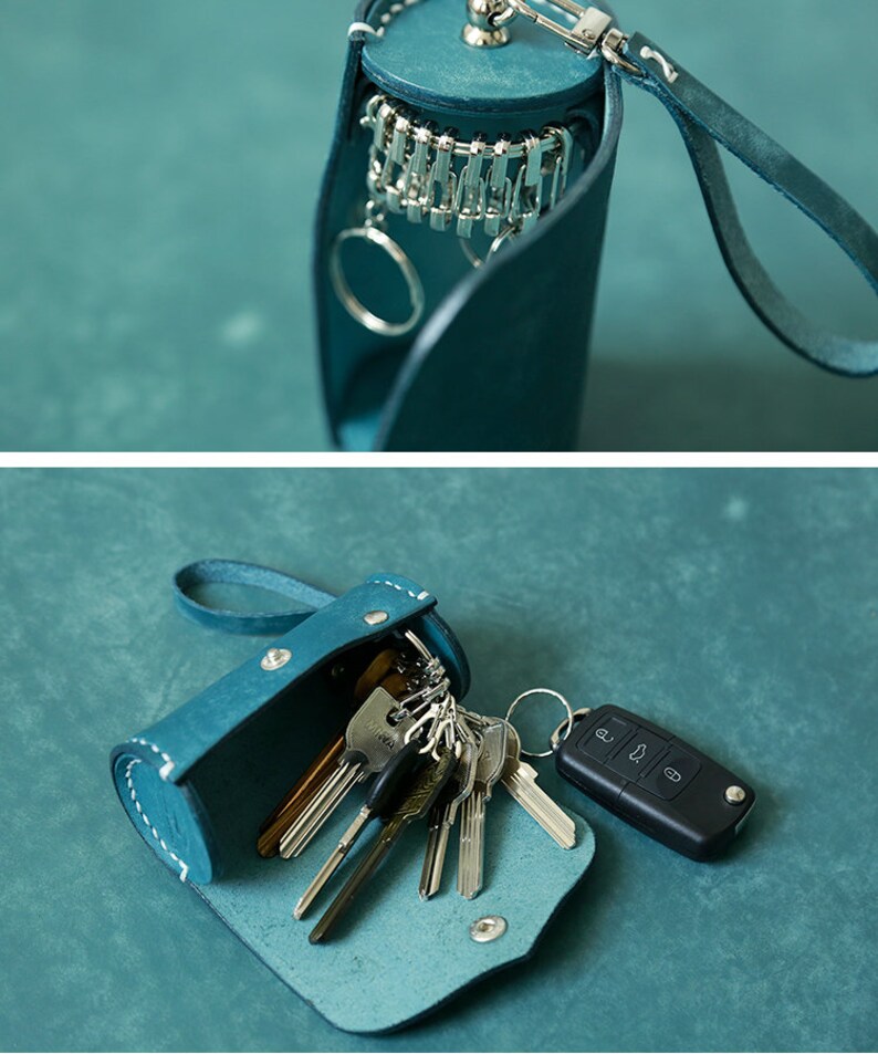 May include: A teal leather key holder with a snap closure and a loop for attaching to a belt or bag. The holder is open and filled with keys, including a car key with a remote.