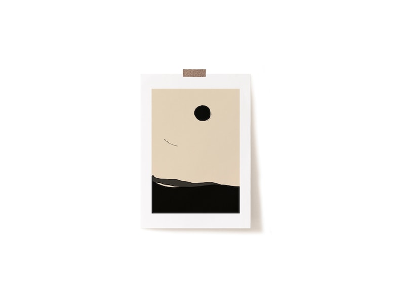 May include: A minimalist art print with a black circle and a thin line against a beige background. The bottom of the print is a black landscape.