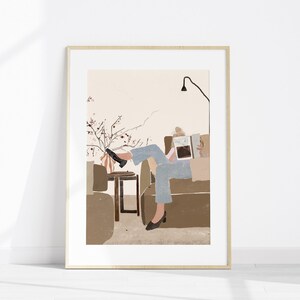 May include: A digital illustration of a person sitting on a couch, reading a book. The person is wearing blue jeans and a white shirt. The couch is brown and there is a small table next to it. There is a plant with pink flowers in the background.