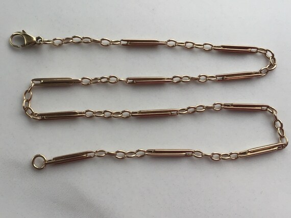 Antique Edwardian 9ct cable and trombone chain.