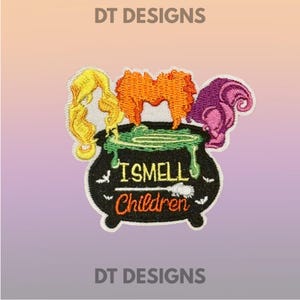 May include: Embroidered patch featuring a black cauldron with green bubbling liquid and three stylized hair designs in yellow, orange, and purple. The text "I SMELL Children" is embroidered on the cauldron. The patch is bordered in white.
