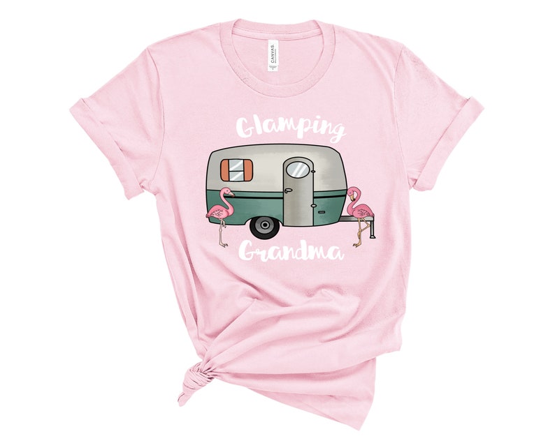 May include: Pink t-shirt with a white camper van graphic and the text "Glamping Grandma" and two pink flamingos.