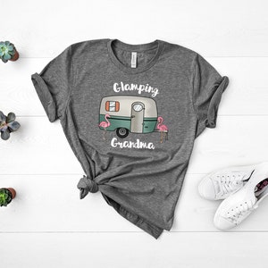 May include: Gray t-shirt with a white camper van and the text "Glamping Grandma" and two pink flamingos.
