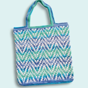 May include: A crocheted tote bag with a chevron pattern in shades of blue, green, and white.