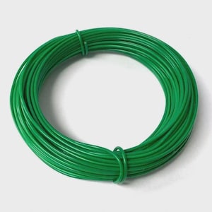 May include: A tightly wound coil of vibrant green wire. The wire has a smooth, glossy appearance and is a solid, consistent colour. The coil is circular and evenly formed, suitable for crafts or gardening projects.