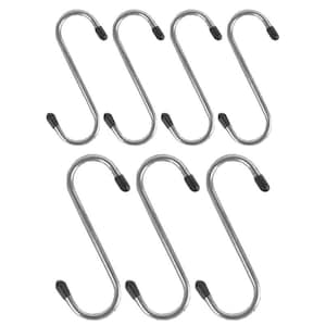 May include: A set of seven silver-coloured metal S-shaped hooks arranged in two rows. Each hook features a smooth, curved design with small, black protective caps on both ends to prevent scratching and ensure a secure grip on surfaces.