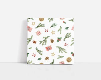 Peut inclure: Impression sur toile carrée avec un motif de Noël. Le motif comprend des illustrations à l'aquarelle de branches de pin, de boîtes cadeaux, de baies, d'étoiles, de pommes de pin et de tranches d'orange sur fond blanc. Un article de décoration saisonnier.