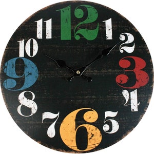 May include: A round, black wooden clock with colourful numbers. The numbers are in a vintage style font and are painted in red, green, blue, yellow, and white. The clock has black hands and a distressed look.