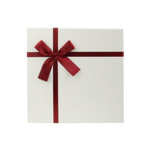 May include: A white gift box with a red ribbon and bow.