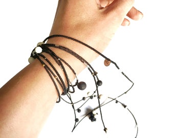 Long, two-in-one black and white porcelain necklace - bracelet