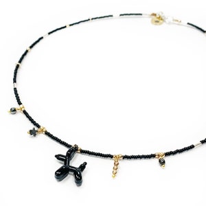 Minimal necklace with a balloon dog pendant