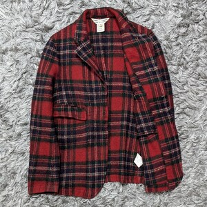 May include: A red and black plaid blazer with a two-button closure and two front pockets. The jacket has a classic lapel collar and is made of a textured fabric. The blazer is a medium weight and suitable for cooler weather.