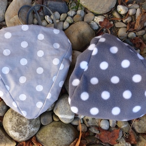 Reversible saddle cap, saddle guard, saddle hood