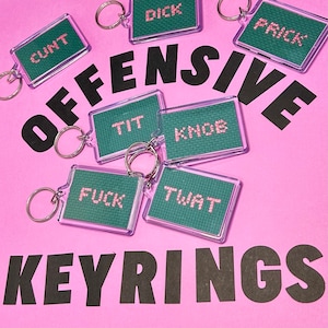 Porte-clés point de croix offensif Knob