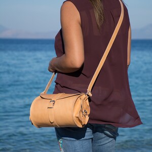 Women's brown leather barrel crossbody purse, tube saddle bag handmade in Greece with full grain cowhide leather KYANIA image 9
