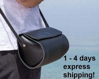 Women's small black leather barrel saddle crossbody purse, handmade in Greece with full grain cowhide leather