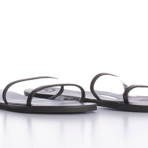 black leather flat slides