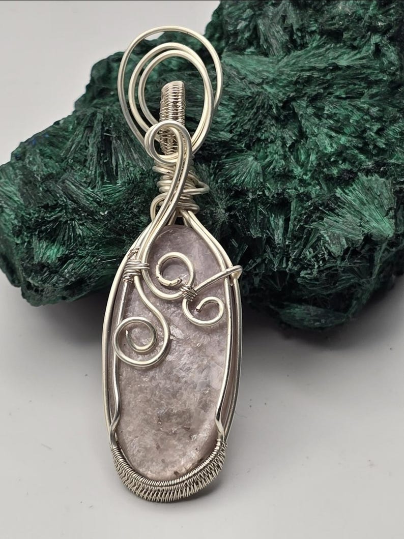 May include: A handmade, wooden cutting board with a natural finish. The board features a live edge on one side and a rectangular shape. It is approximately 18 inches long and 12 inches wide.