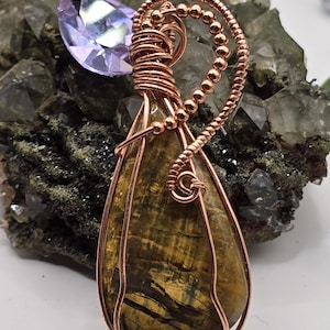 Hand-crafted Wire Wrapped Nellite Jasper Crystal Pendant