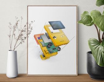 May include: A framed print featuring a detailed illustration of a disassembled yellow handheld gaming console. The artwork shows the internal components, including the screen, circuit board, and cartridge slot, against a white background. The print is displayed on a wooden surface.