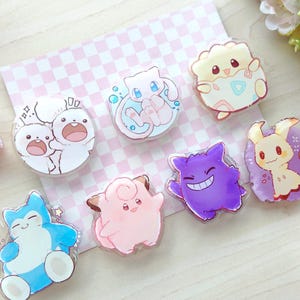 Poké Acrylic grip | Gamer gift, Kawaii phone grips | Phone accessory