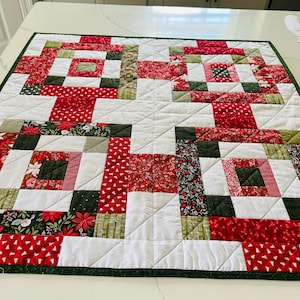 Beautiful Christmas quilted table topper.