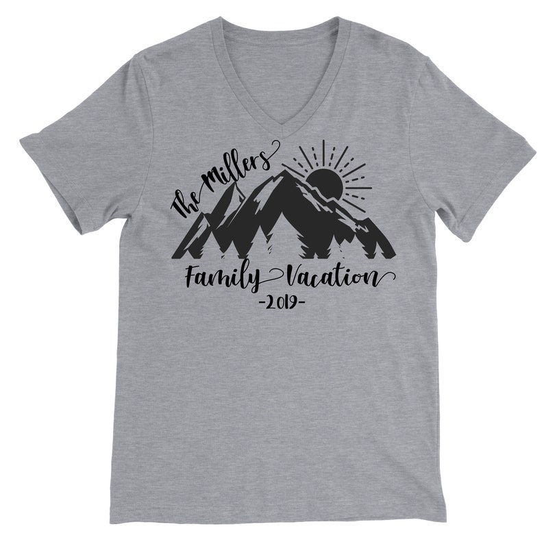 May include: Gray V-neck t-shirt with a black mountain silhouette design. The text "The Millers Family Vacation -2019- " is printed below the mountains.