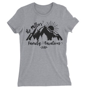 May include: Gray t-shirt with a black mountain silhouette, sun, and trees. The text "The Millers Family Vacation -2019- " is printed on the shirt.