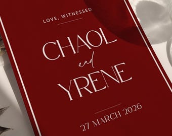 May include: A burgundy wedding invitation with white text reading "CHAOL and YRENE" and "27 MARCH 2026". The invitation has a white border and is next to a clear glass with a gold rim and silver leaves.
