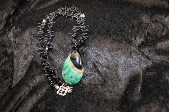 Beaded Necklace with Green Black Pendant - image 1